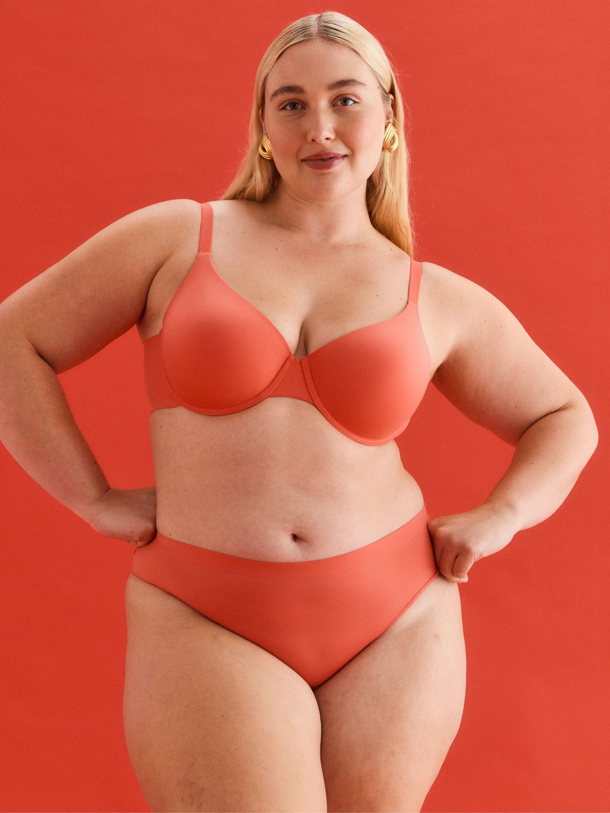 Maddy wears the Alive T-Shirt Bra in Sunset Coral by Kayser Lingerie