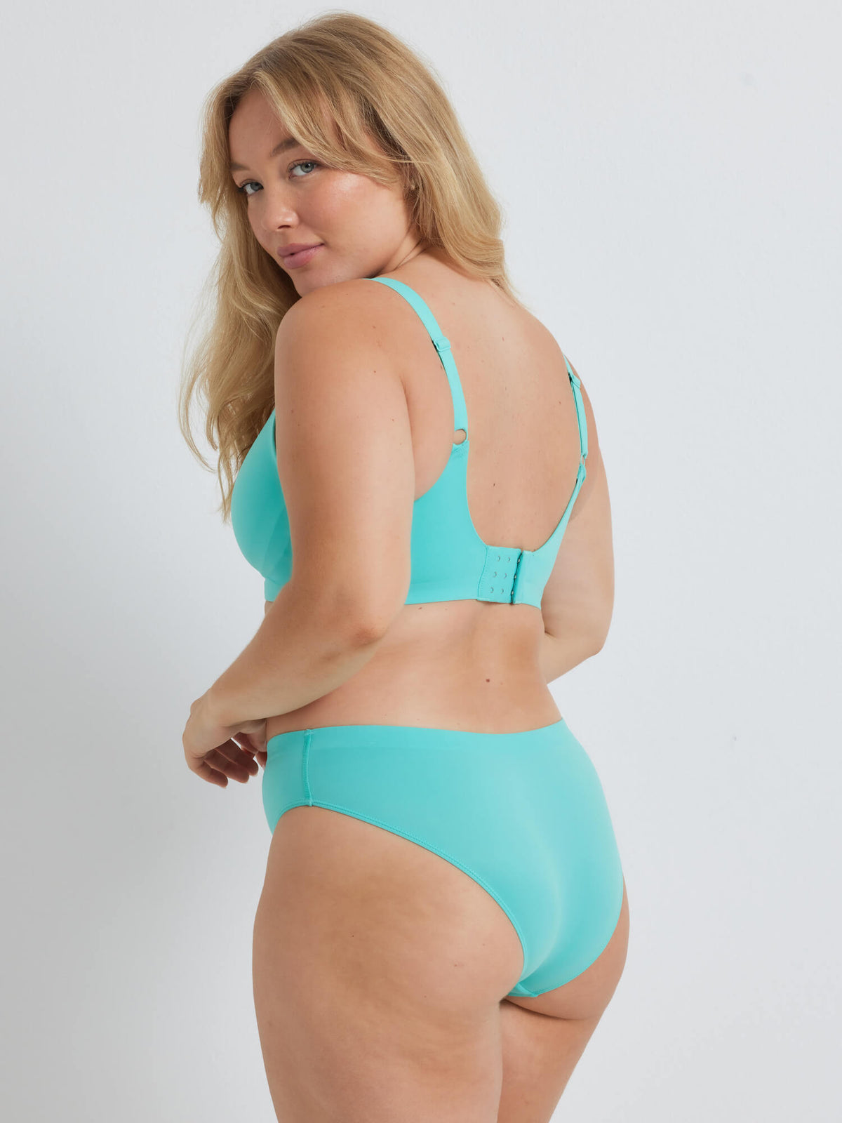 Taylor wears a size 12 in the Alive Brazilian Bikini in Aqua Blue by Kayser Lingerie