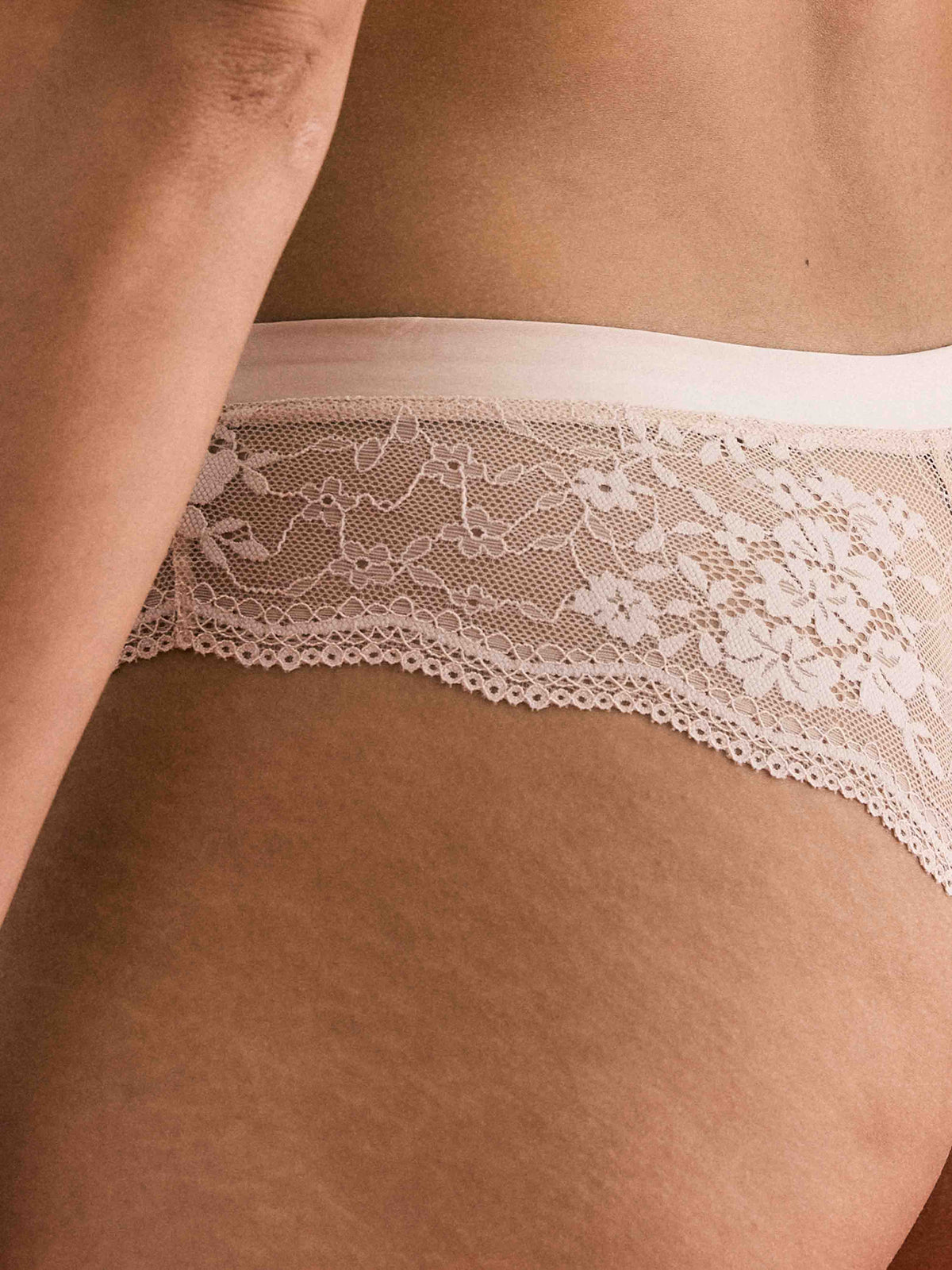 Close up of lace detail on Be Real Cheeky Lace Bikini Underwear in Honey by Kayser Lingerie