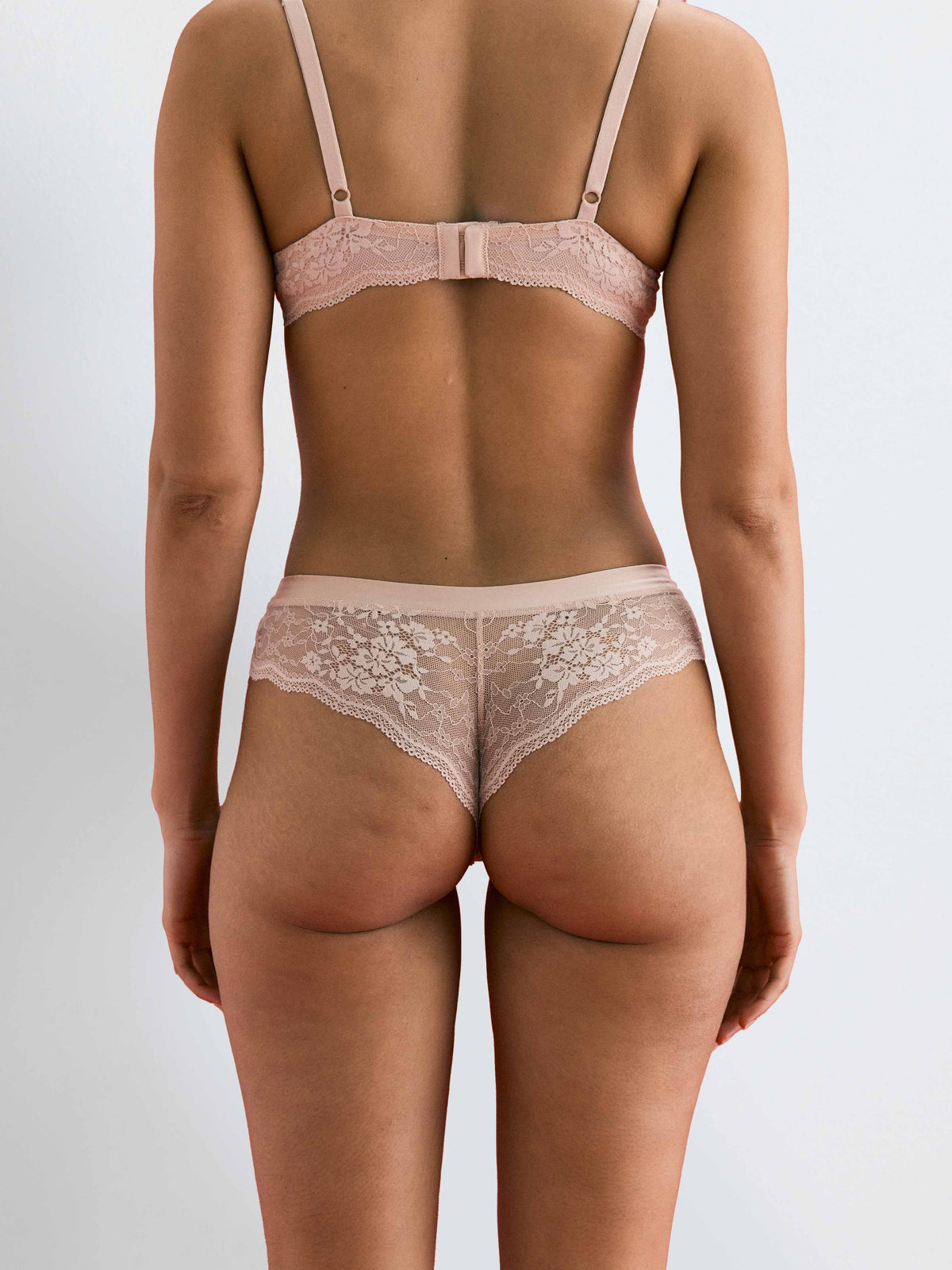 Back of a woman wearing Be Real Cheeky Lace Bikini Underwear in Honey by Kayser Lingerie